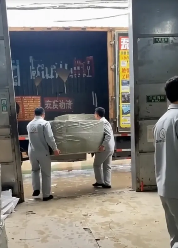 SunCheer team loading packed outerwear goods for shipment